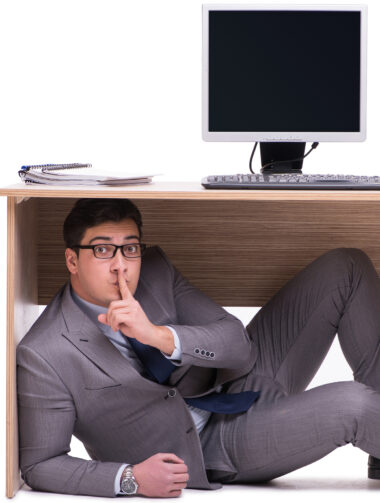 Businessman hiding in the ofice